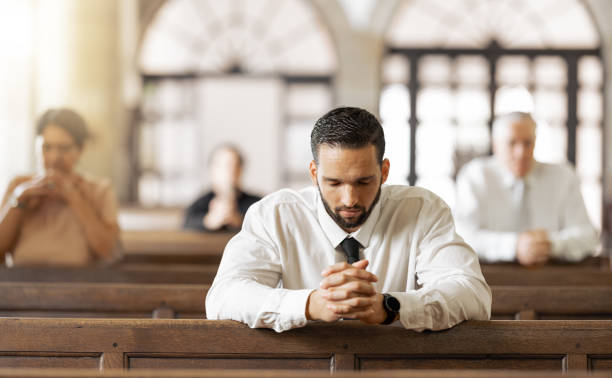 What is the number one problem in the church .  Church, prayer and man praying to God, worship or religion in cathedral. Faith, spiritual and christian community in chapel or sanctuary worshipping Jesus, holy praise or trust and hope in Christ.